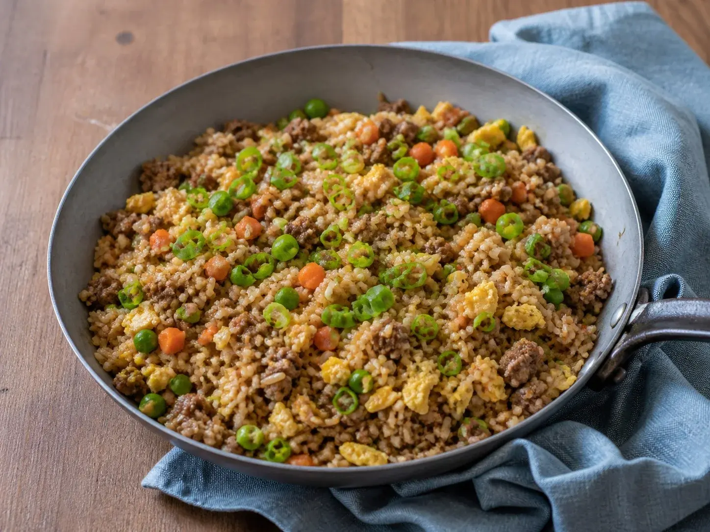 Illustrative image of beef fried rice served in a simple everyday setting