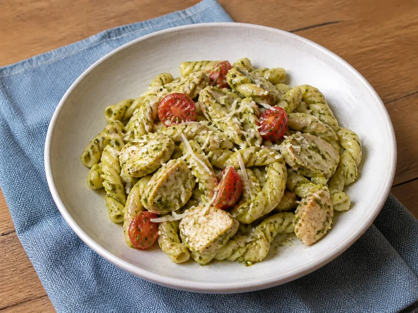 Illustrative image of chicken pesto pasta served in a simple everyday setting