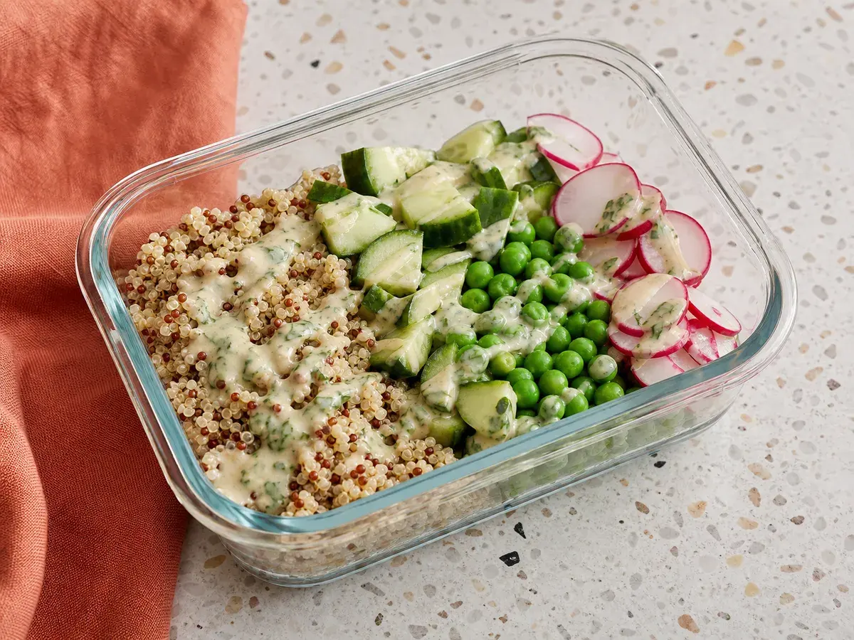 Illustrative image of quinoa lunch boxes with cucumber and herb tahini