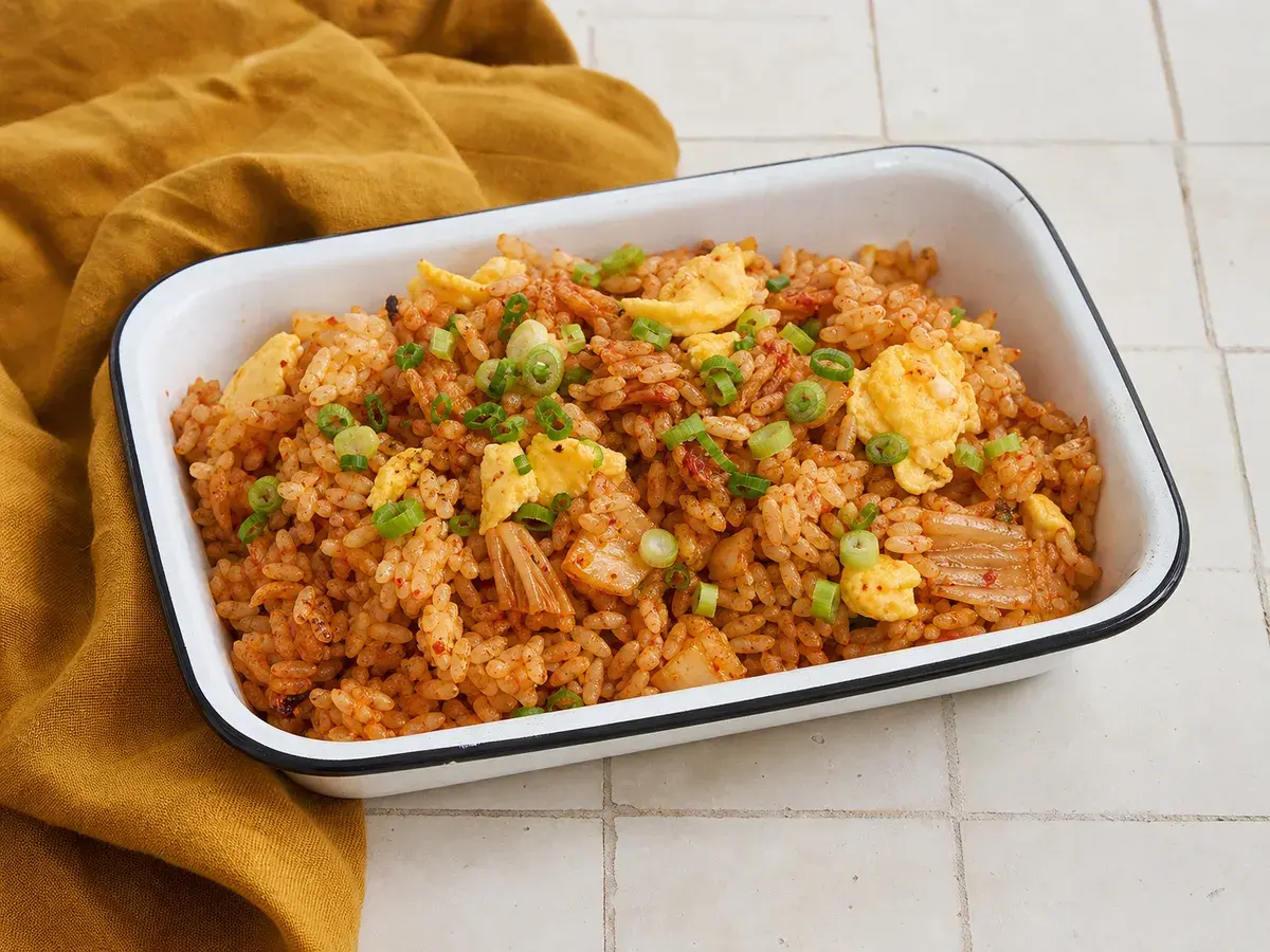 Illustrative image of kimchi egg fried rice served in a simple everyday setting