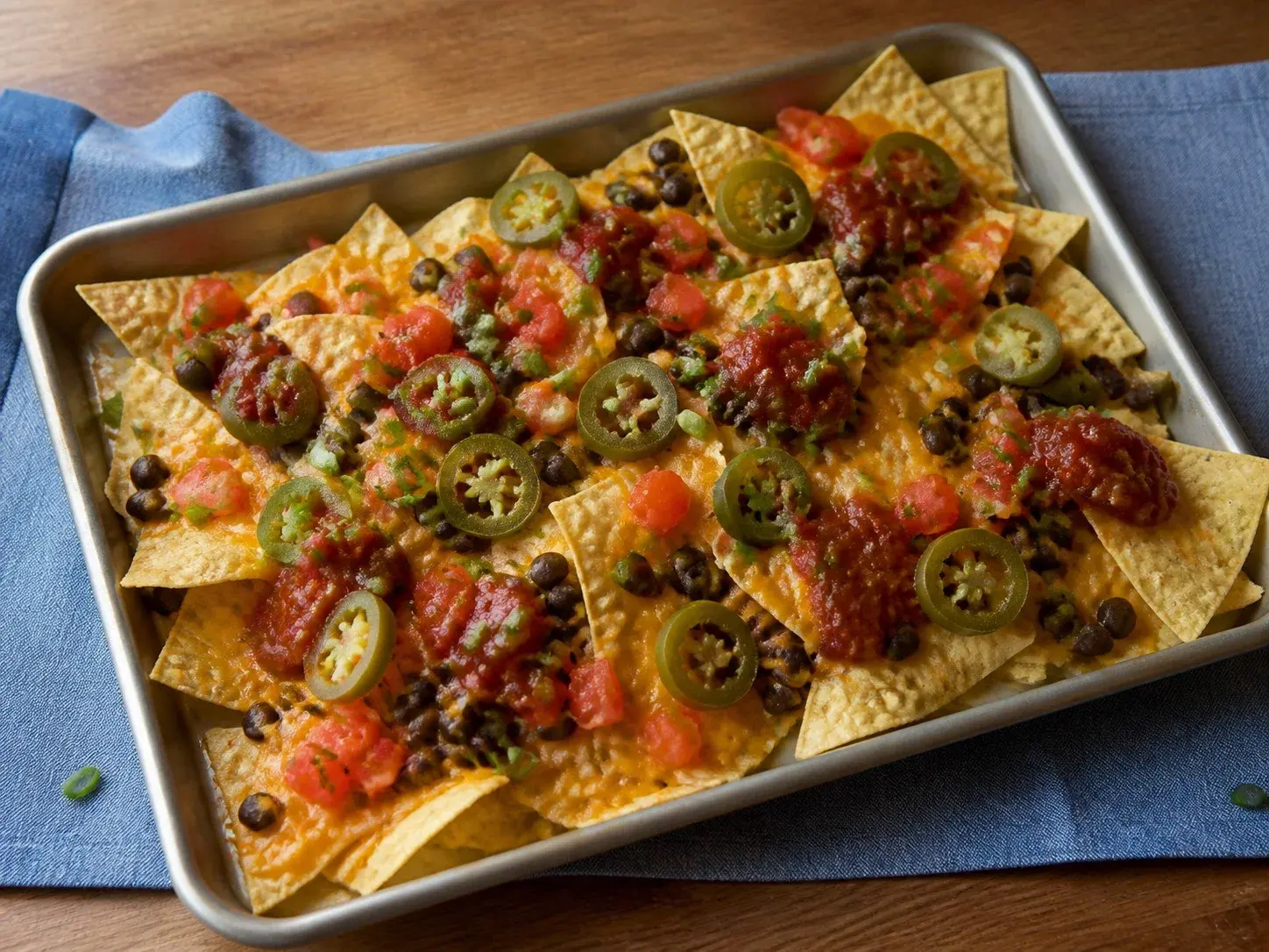 Illustrative image of nachos with beans served in a simple everyday setting