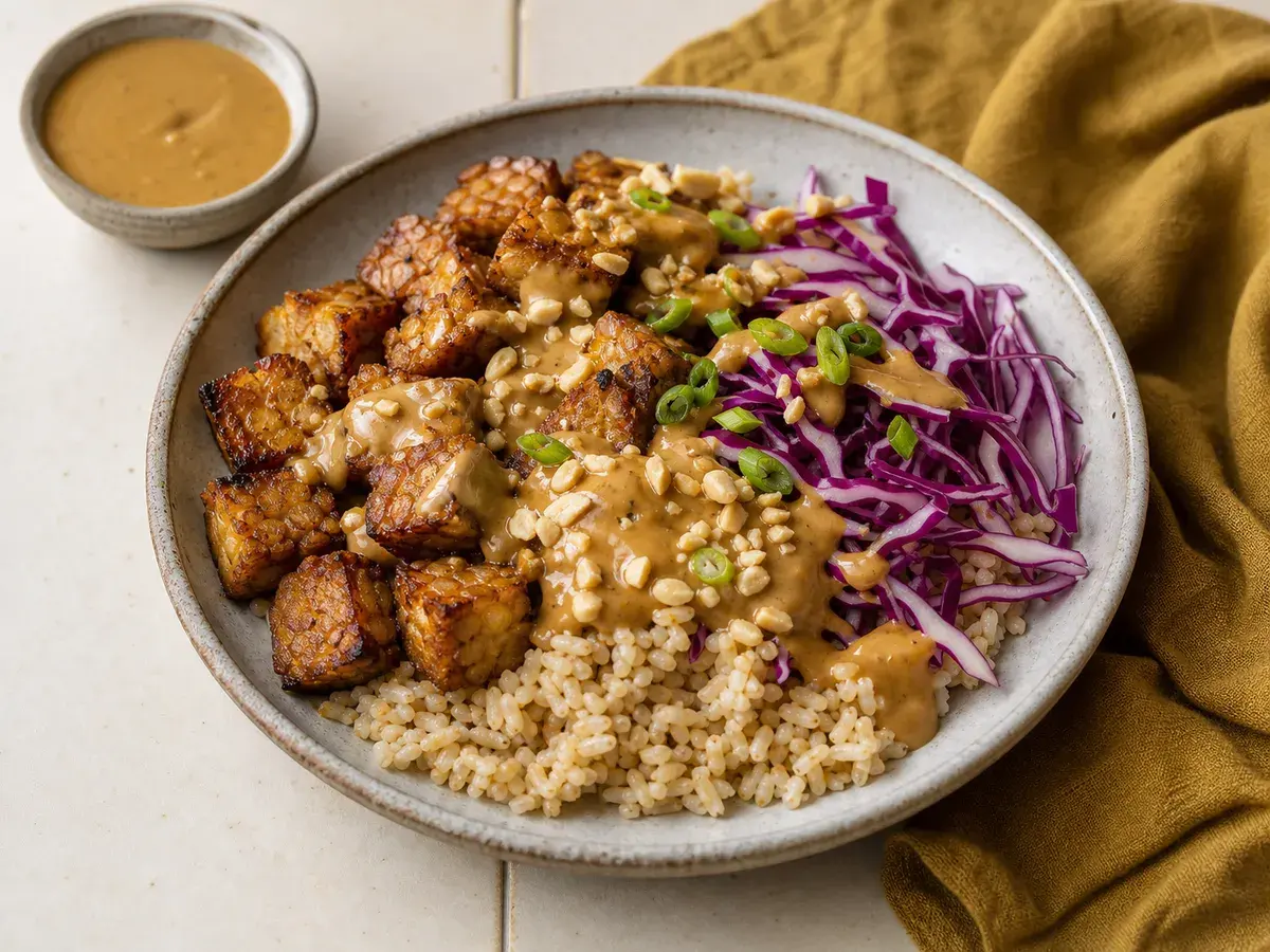 Illustrative image of peanut tempeh grain bowls with cabbage
