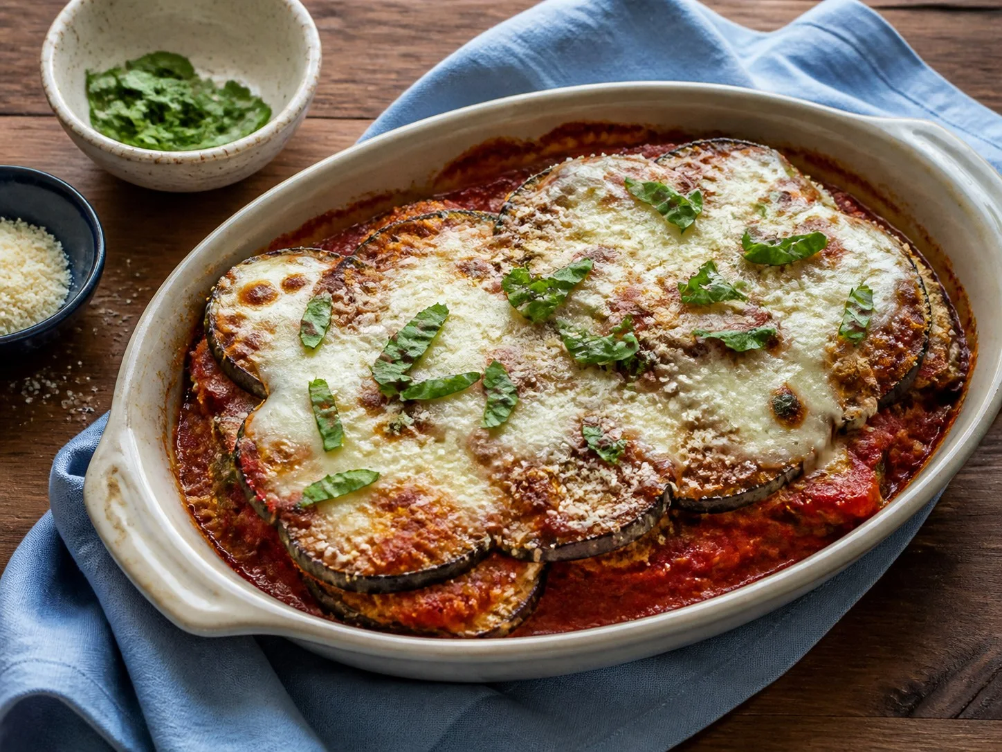 Illustrative image of eggplant parmesan served in a simple everyday setting
