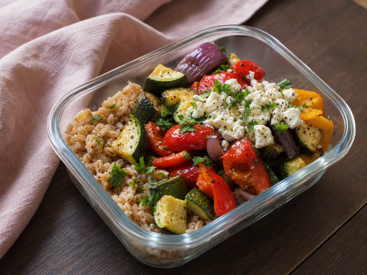 Illustrative image of roasted vegetable feta bowl served in a simple everyday setting
